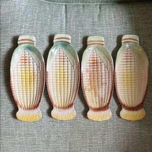 4 vintage corn on the cob ceramic holders.